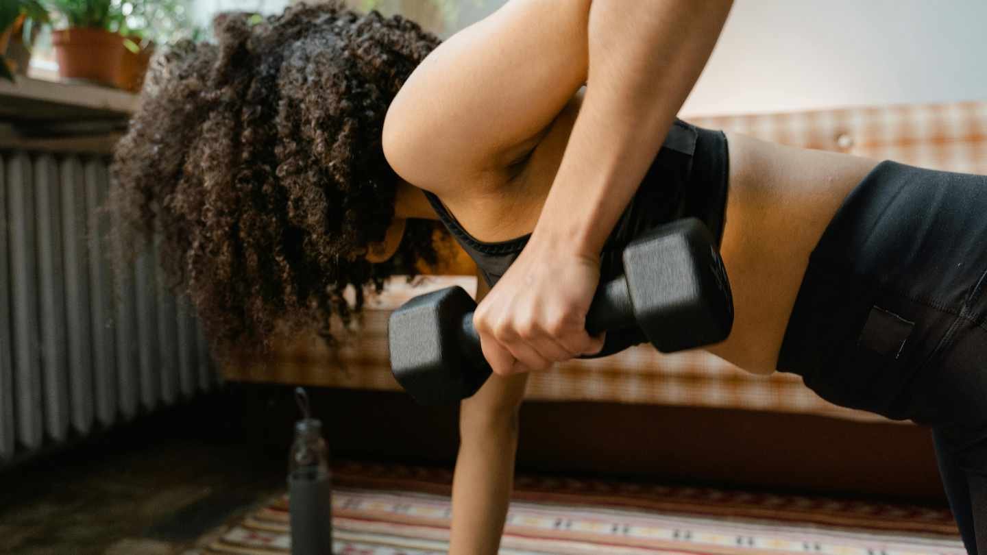 A Woman Exercising with a Dumbbell