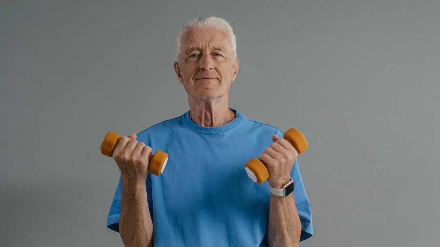 Older Person Exercising With Dumbbells