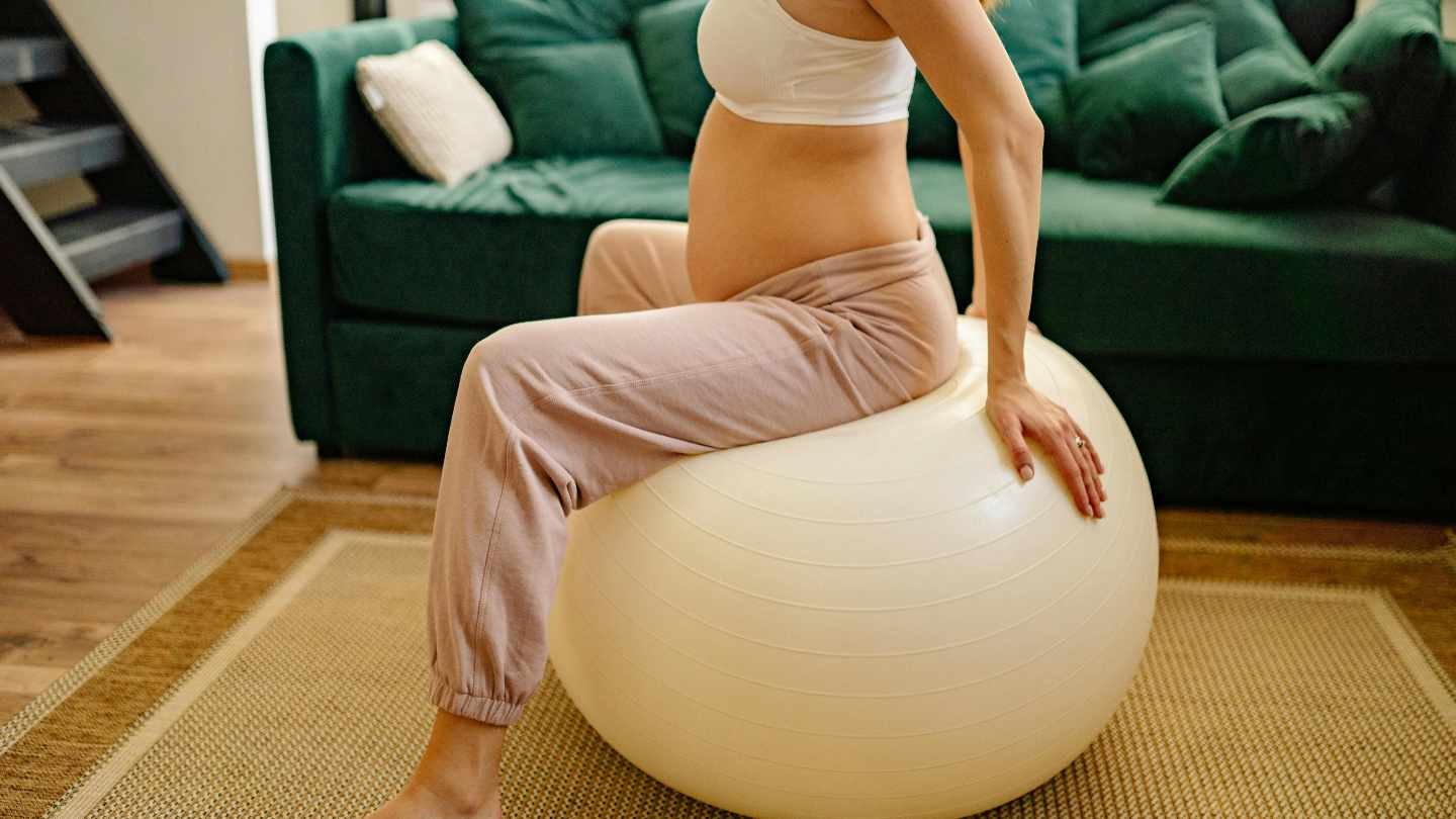 Pregnant Woman Using An Exercise Ball