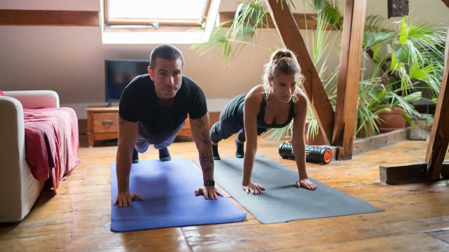 Couple Doing Plank Exercise