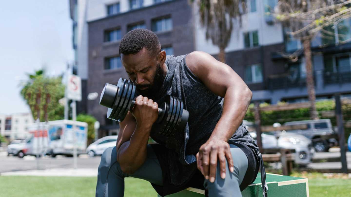 Man with Adjustable Dumbbell