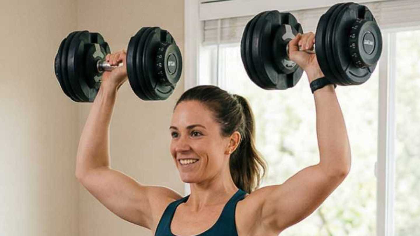 Woman Lifting Adjustable Dumbbells